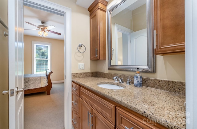 bathroom with ceiling fan and vanity