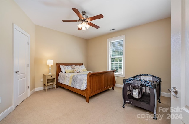 carpeted bedroom featuring ceiling fan