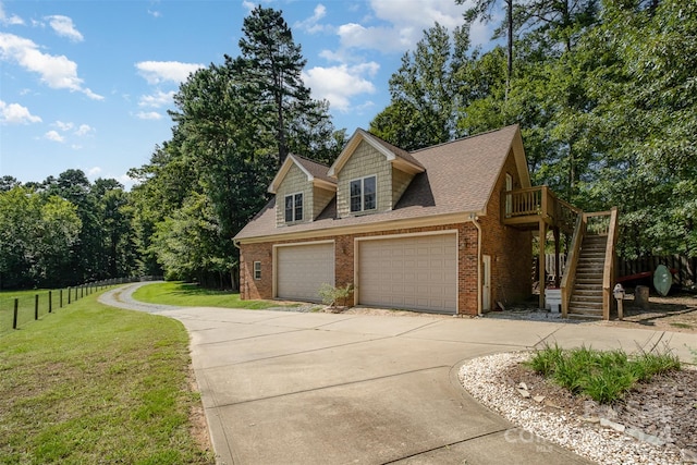 view of front of property featuring a garage and a front lawn