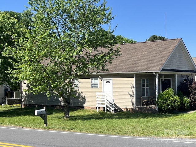 view of front of home with a front yard