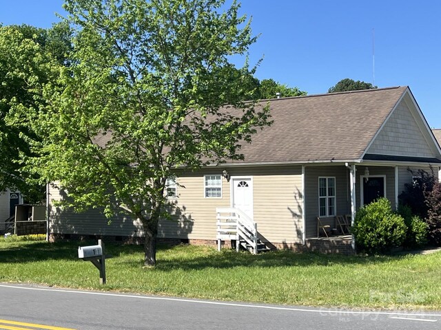 1245 Carolyn Ave, Kannapolis, NC 28083 - view of front of property with a shingled roof, entry steps, a front lawn, and crawl space