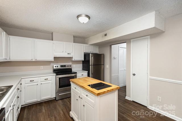 kitchen with stainless steel appliances, white cabinetry, and dark wood-type flooring