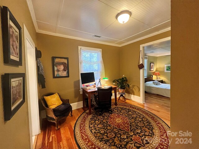 office featuring crown molding and light hardwood / wood-style floors