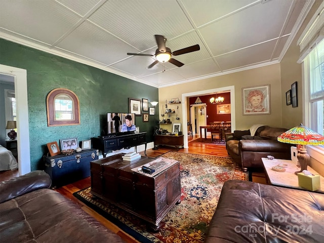 living room featuring ceiling fan with notable chandelier and hardwood / wood-style flooring