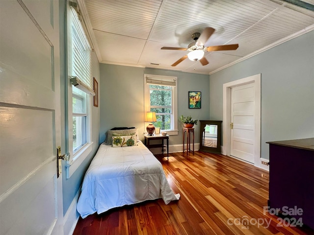 bedroom featuring crown molding, hardwood / wood-style floors, and ceiling fan