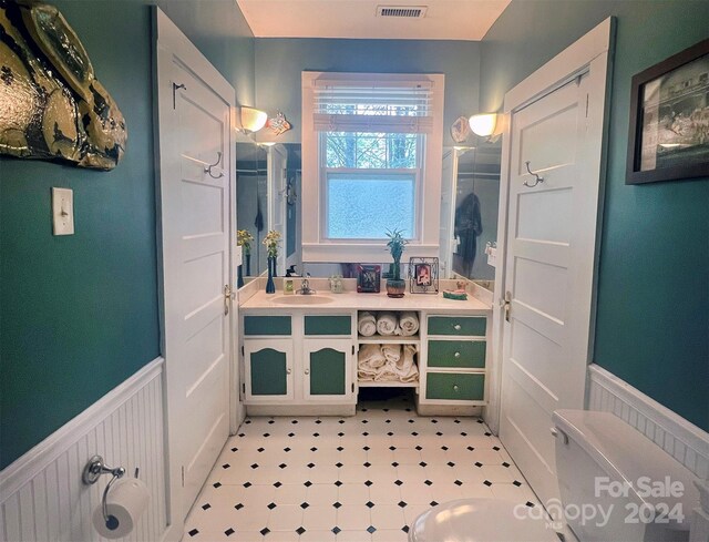 bathroom with vanity and tile patterned floors