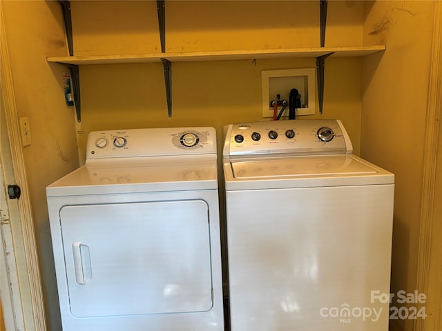 washroom featuring independent washer and dryer