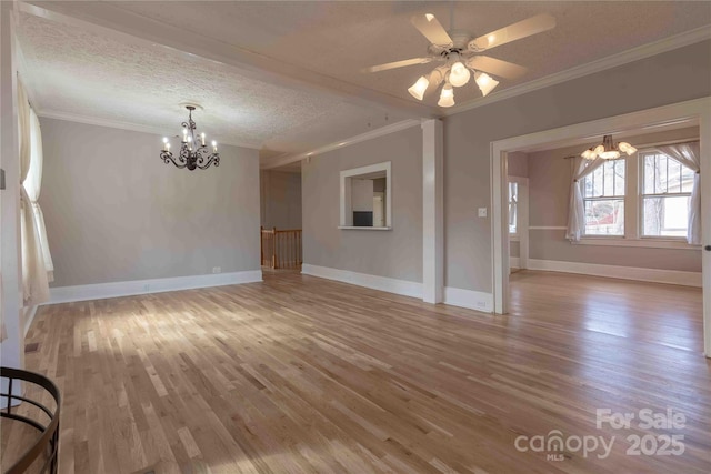 interior space featuring crown molding, a textured ceiling, and hardwood / wood-style flooring