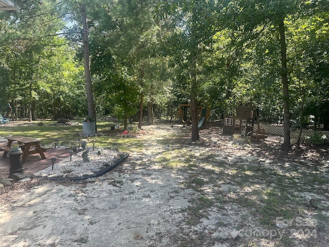 view of yard with a playground