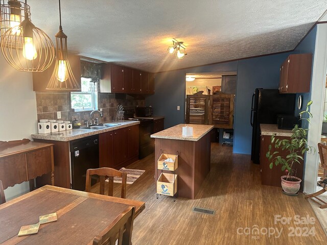 kitchen with a textured ceiling, dark hardwood / wood-style flooring, black dishwasher, backsplash, and sink