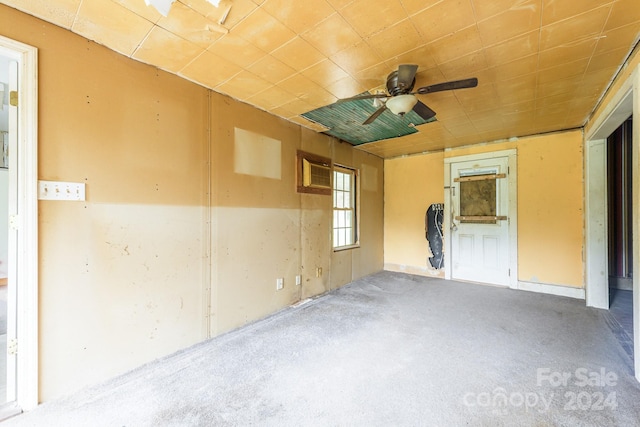 interior space with ceiling fan