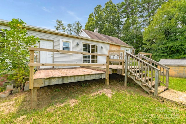 rear view of house with a wooden deck