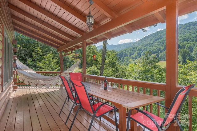 wooden deck with a mountain view