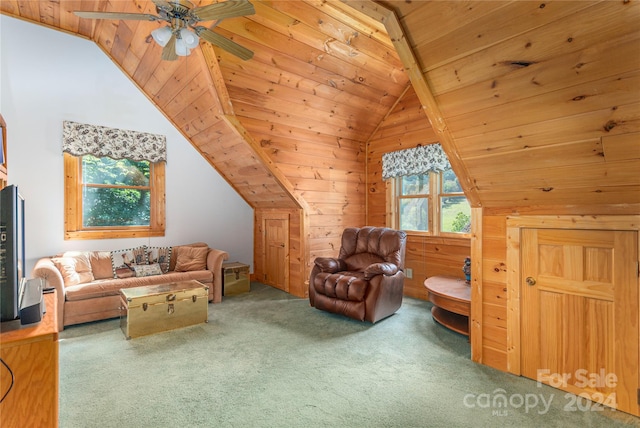 living area with wood ceiling, wooden walls, vaulted ceiling, carpet floors, and ceiling fan