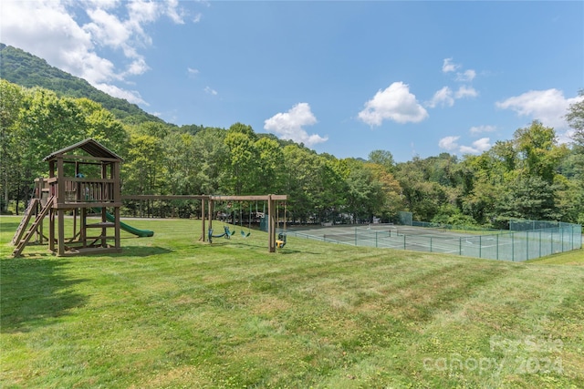 exterior space with a mountain view and a playground