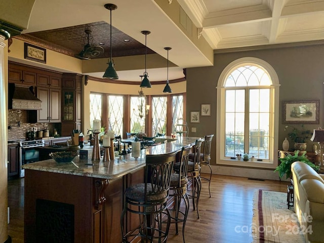 kitchen with backsplash, coffered ceiling, electric range oven, dark hardwood / wood-style flooring, and custom exhaust hood