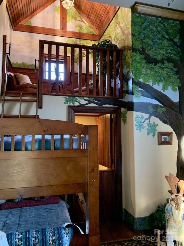 bedroom with vaulted ceiling and wood ceiling