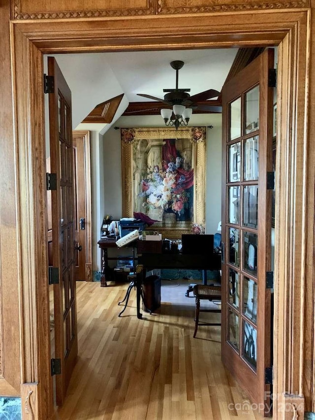 interior space with ceiling fan and hardwood / wood-style floors