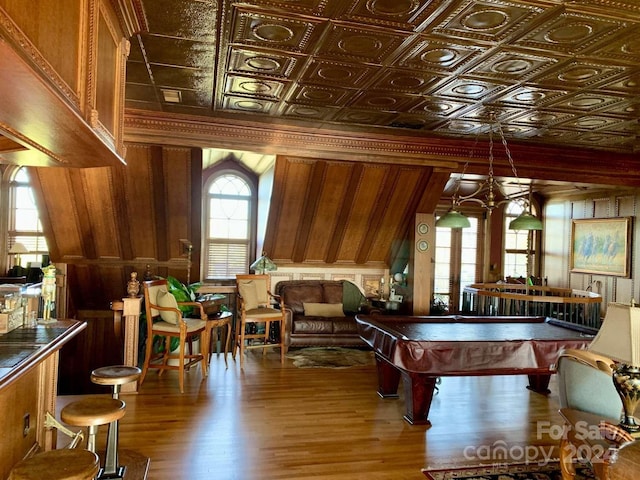 rec room featuring wooden walls, hardwood / wood-style floors, and pool table