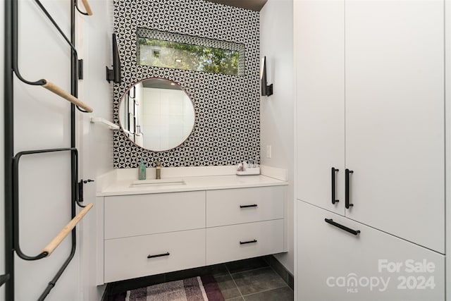 bathroom with tile patterned floors and vanity