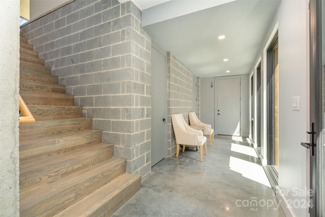 stairway with concrete floors