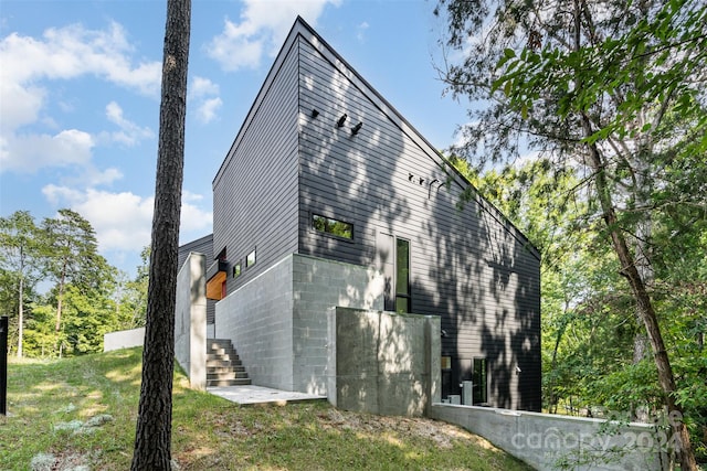 view of home's exterior featuring a lawn