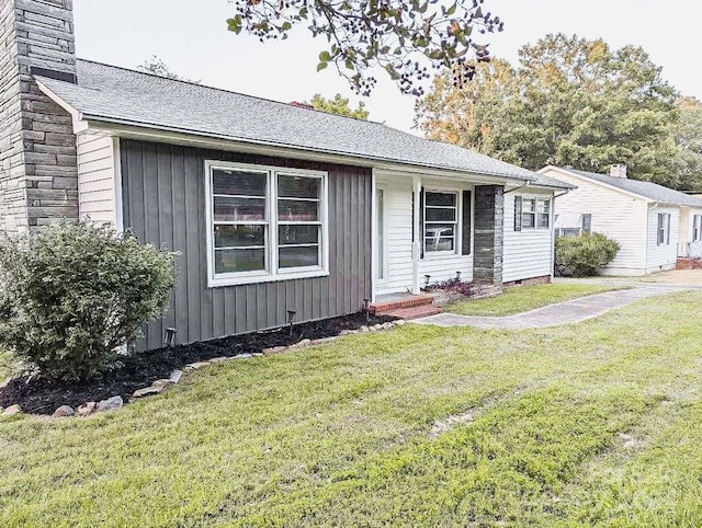 ranch-style house with a front lawn