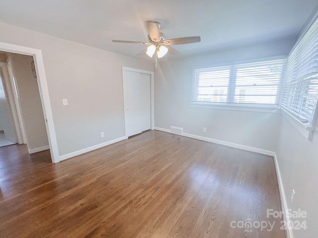 spare room featuring hardwood / wood-style flooring and ceiling fan