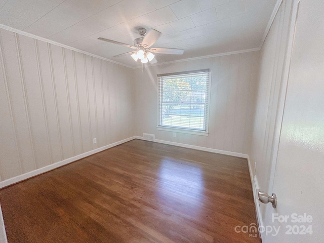 spare room with ceiling fan, hardwood / wood-style floors, and ornamental molding