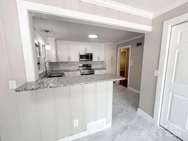 kitchen with stainless steel appliances, white cabinetry, sink, crown molding, and hanging light fixtures