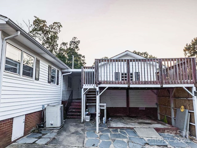 view of patio with a deck and cooling unit