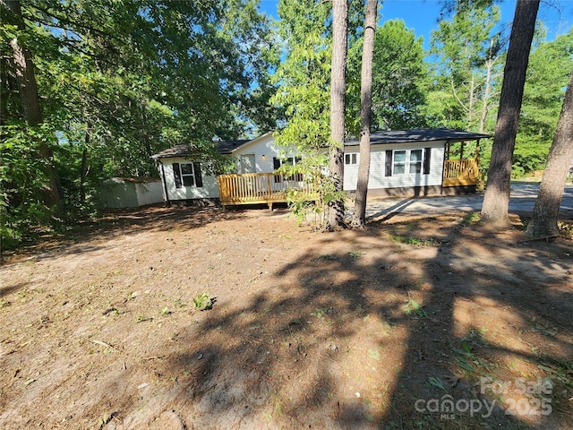 view of yard featuring a deck