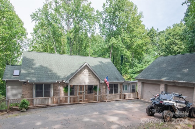 view of front of house with a garage and covered porch