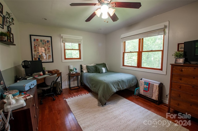 bedroom featuring ceiling fan and dark hardwood / wood-style floors