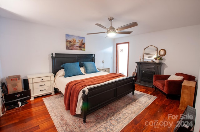 bedroom featuring ceiling fan and dark hardwood / wood-style floors