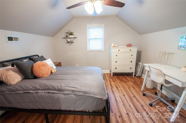 bedroom with lofted ceiling, light hardwood / wood-style flooring, and ceiling fan