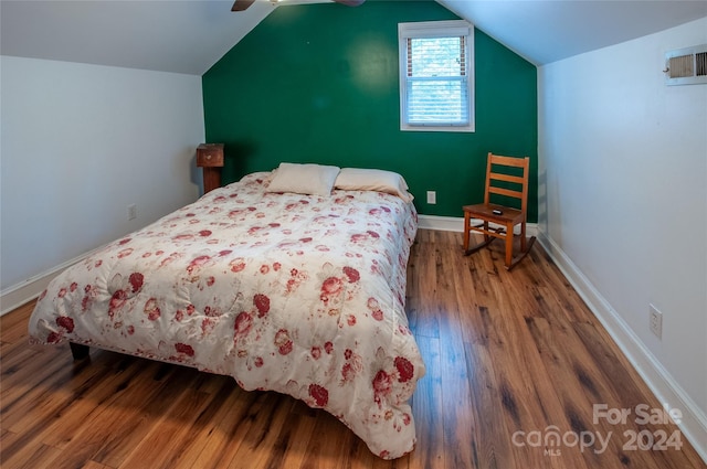 bedroom with lofted ceiling, ceiling fan, and hardwood / wood-style floors