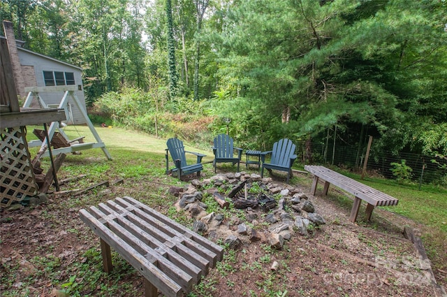 view of yard with a fire pit