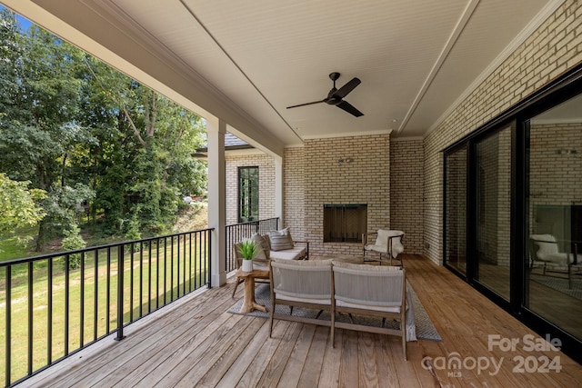 wooden terrace featuring ceiling fan