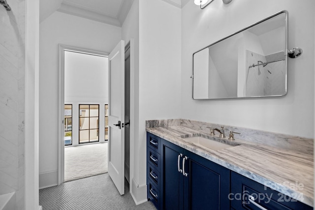 bathroom featuring tile patterned floors, vanity, a shower, and ornamental molding