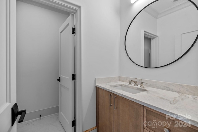 bathroom with tile patterned flooring, vanity, and ornamental molding