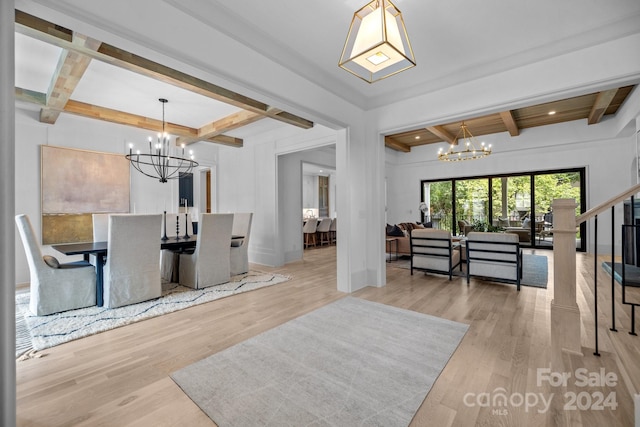 interior space with a notable chandelier, beamed ceiling, and light hardwood / wood-style floors