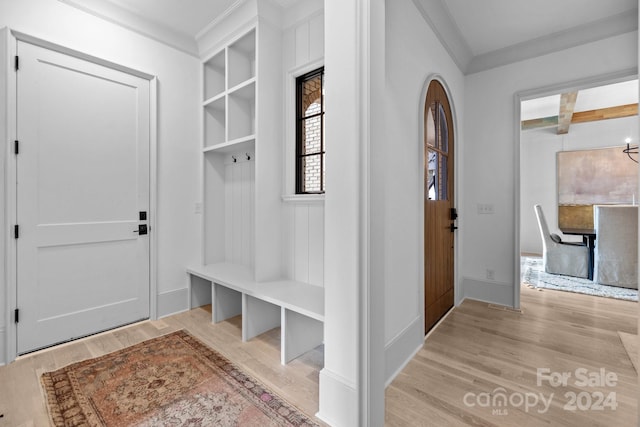 mudroom featuring crown molding, beamed ceiling, light wood-type flooring, and coffered ceiling