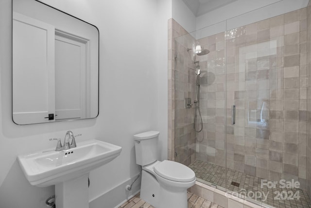 bathroom with sink, toilet, walk in shower, and tile patterned floors