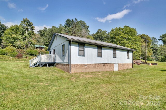 view of property exterior featuring a yard