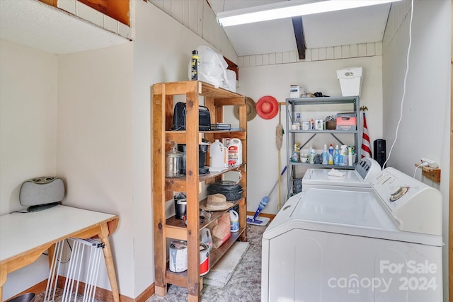 clothes washing area with separate washer and dryer