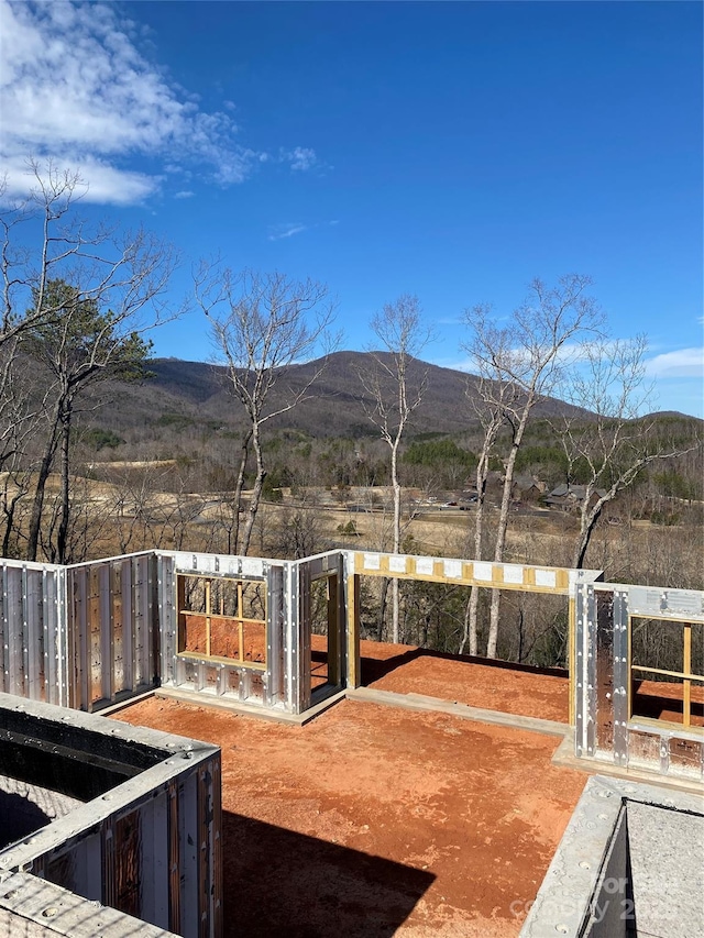 view of yard with a gate, a mountain view, and fence