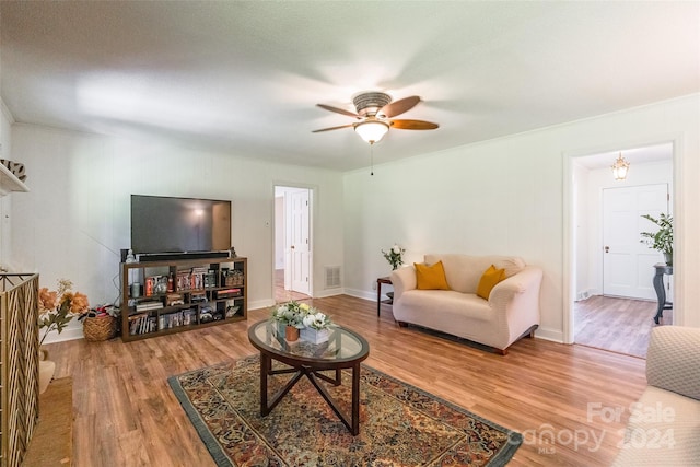 living room featuring ceiling fan and light wood-type flooring