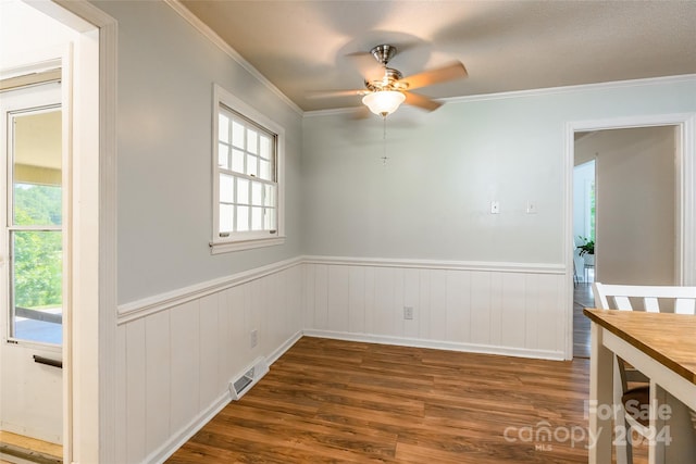 interior space featuring hardwood / wood-style flooring, ornamental molding, and ceiling fan