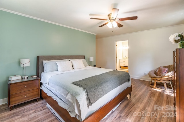 bedroom with ceiling fan, ensuite bathroom, ornamental molding, and dark hardwood / wood-style flooring